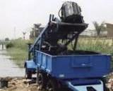 Discharging Bucket Into Trailer